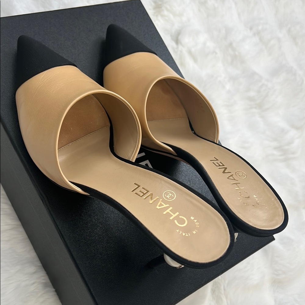 Don’t buy reserved for Samantha. Chanel Black and Tan Mules with Sleek Design